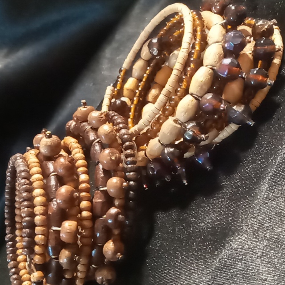 Two's company designer wooden beaded wrapped bracelets .